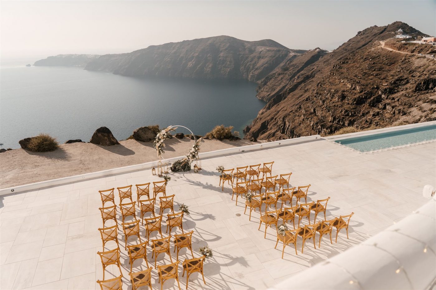 Rocabella Santorini wedding venue in Santorini, Greece – cliffside resort with whitewashed architecture, Aegean Sea views, and romantic outdoor ceremony spaces.