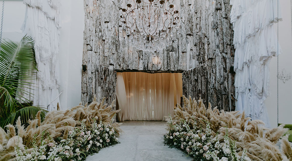 Casa Malca wedding venue in Tulum, Mexico – luxury beachfront boutique hotel with eclectic art-filled design, white sand beaches, and a romantic tropical setting for destination weddings and elopements.