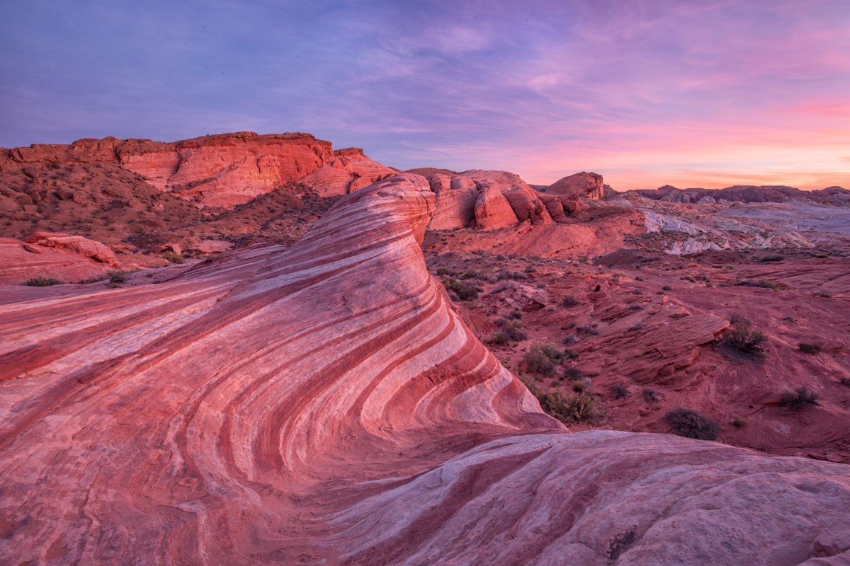 Sunrise over red and pink sandstone formations at Valley of Fire State Park – unique places to elope in Nevada