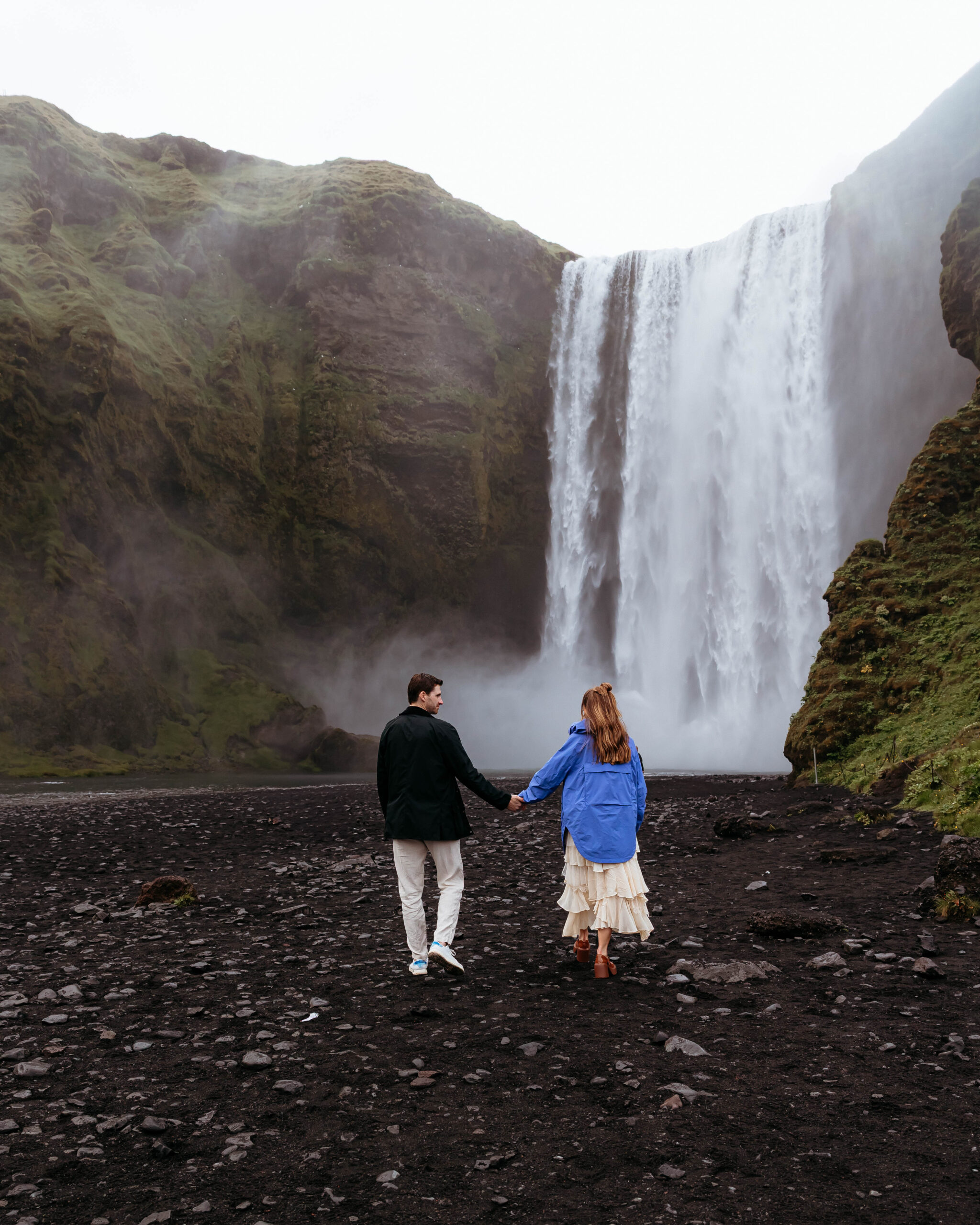 Romantic Iceland engagement photos at Skógafoss waterfall