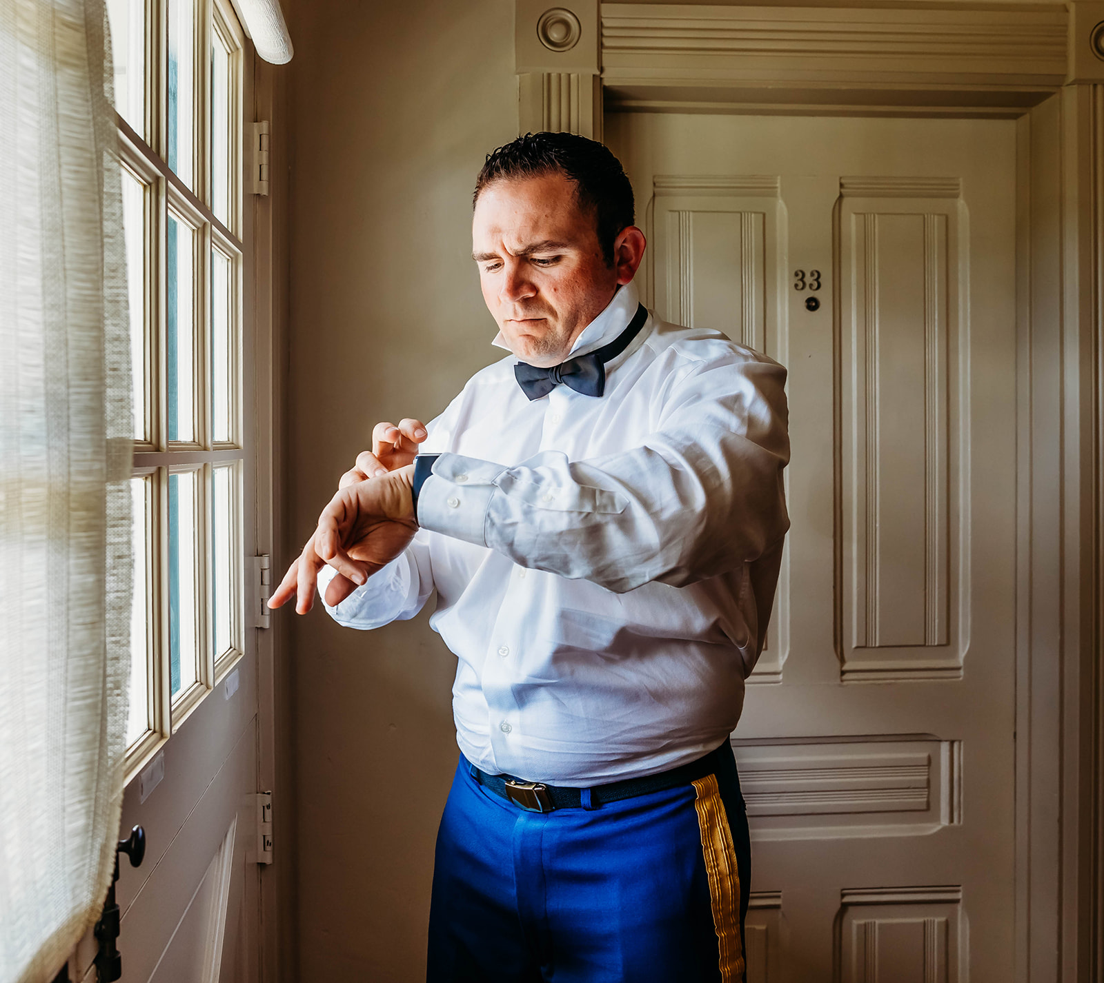 Groom getting ready at Mission Ranch Inn in California